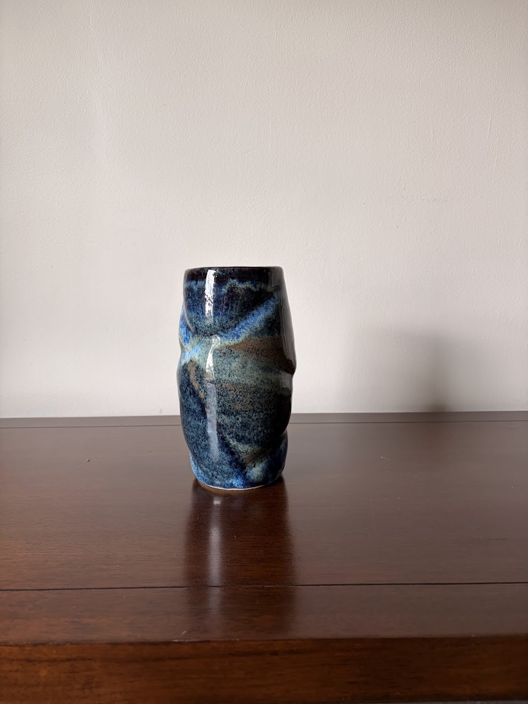Tall ceramic vase in layered deep blue glazes